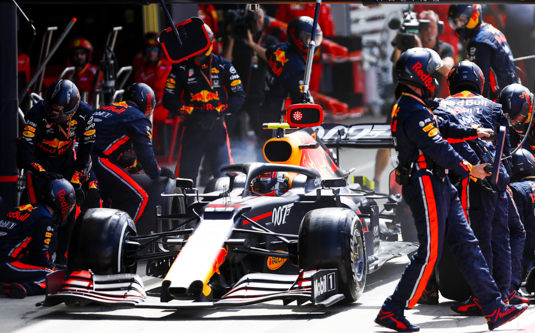 The picture of the pit stop of Formula 1 by Red Bull. 